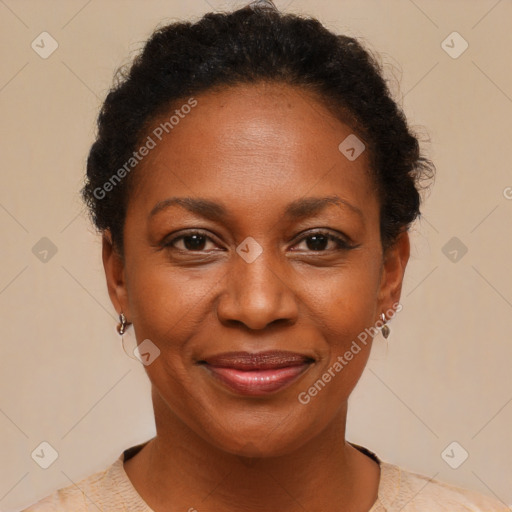 Joyful black adult female with short  brown hair and brown eyes