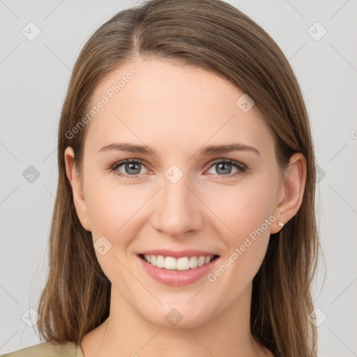 Joyful white young-adult female with long  brown hair and grey eyes