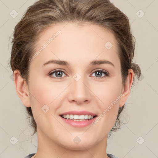 Joyful white young-adult female with medium  brown hair and green eyes