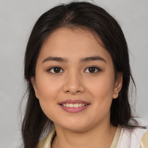 Joyful asian young-adult female with medium  brown hair and brown eyes