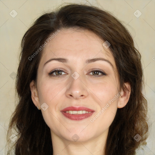 Joyful white adult female with long  brown hair and brown eyes