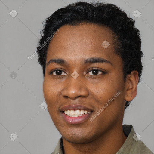 Joyful black young-adult male with short  black hair and brown eyes