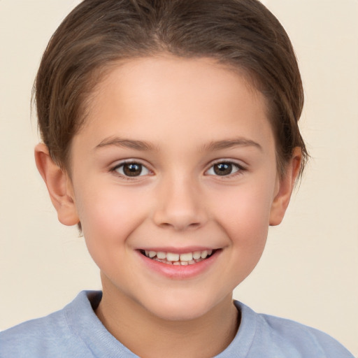 Joyful white child female with short  brown hair and brown eyes