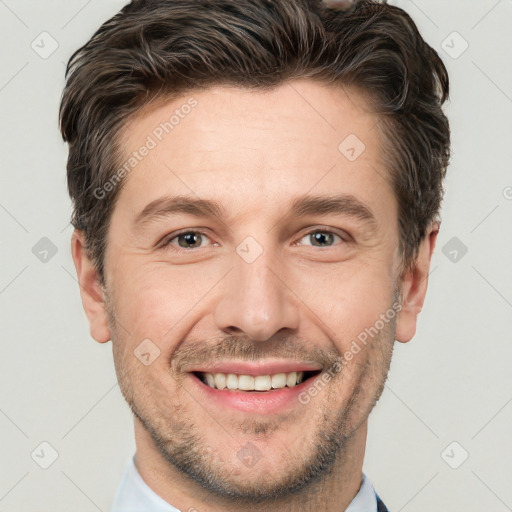 Joyful white adult male with short  brown hair and grey eyes