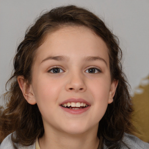 Joyful white child female with medium  brown hair and brown eyes