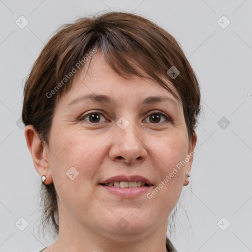 Joyful white adult female with medium  brown hair and grey eyes