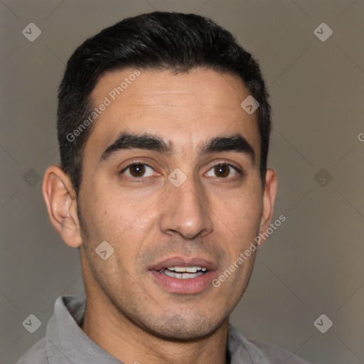 Joyful white young-adult male with short  black hair and brown eyes