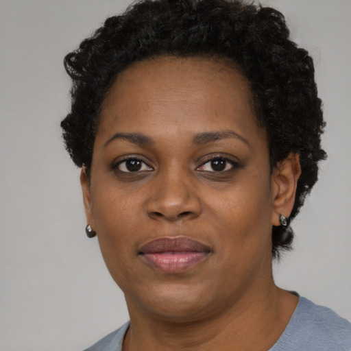 Neutral black adult female with short  black hair and brown eyes