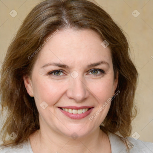 Joyful white adult female with medium  brown hair and grey eyes