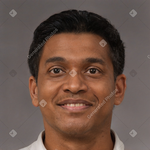Joyful latino young-adult male with short  brown hair and brown eyes