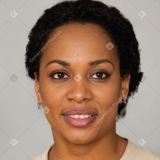 Joyful black young-adult female with short  brown hair and brown eyes