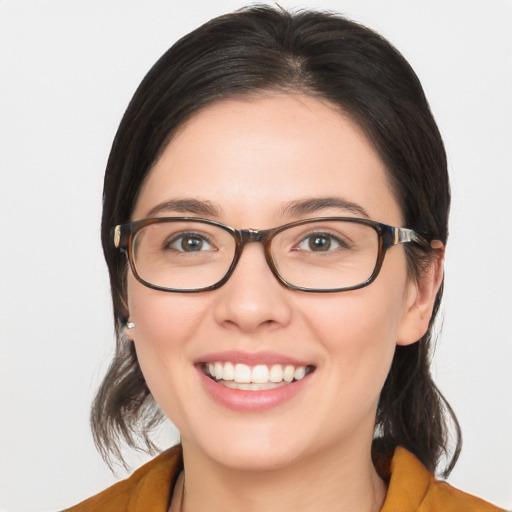 Joyful white young-adult female with medium  brown hair and brown eyes