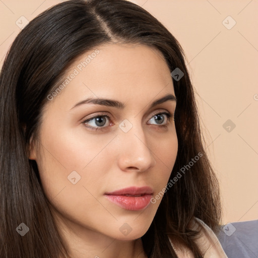 Neutral white young-adult female with long  brown hair and brown eyes