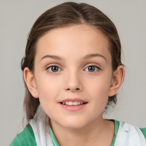 Joyful white child female with medium  brown hair and brown eyes