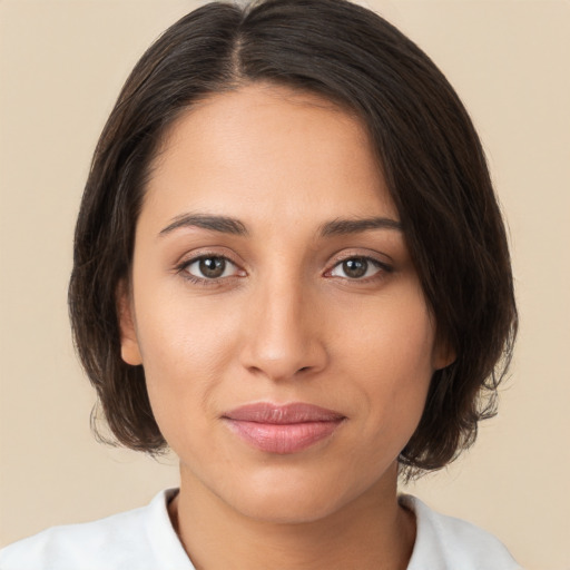 Joyful white young-adult female with medium  brown hair and brown eyes