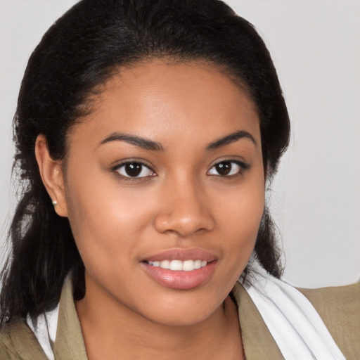 Joyful latino young-adult female with medium  brown hair and brown eyes