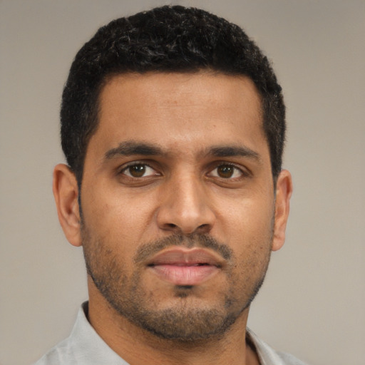 Neutral black young-adult male with short  black hair and brown eyes