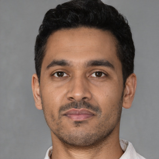 Neutral latino young-adult male with short  black hair and brown eyes