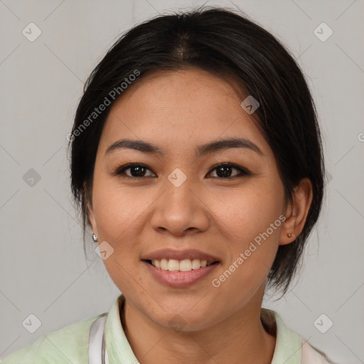 Joyful asian young-adult female with medium  brown hair and brown eyes