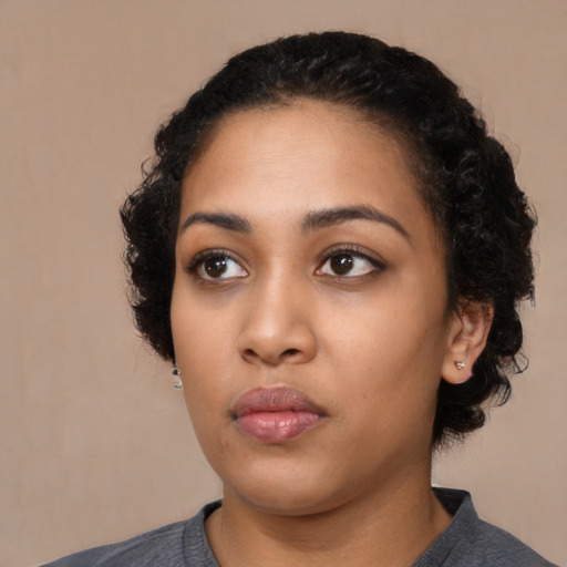 Neutral latino young-adult female with medium  black hair and brown eyes
