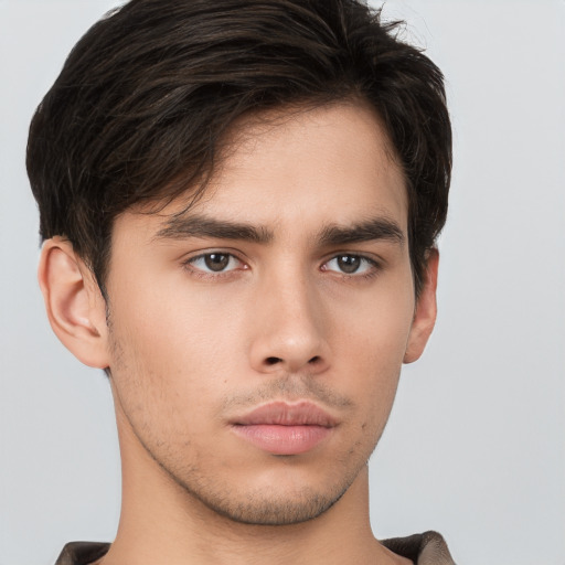 Neutral white young-adult male with short  brown hair and brown eyes