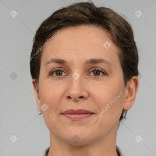 Joyful white adult female with short  brown hair and brown eyes