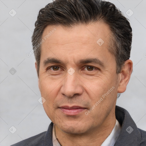 Joyful white adult male with short  brown hair and brown eyes