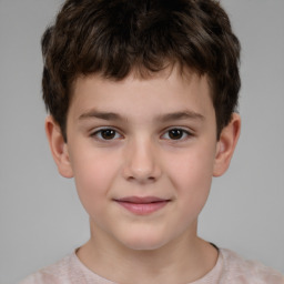 Joyful white child male with short  brown hair and brown eyes