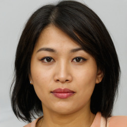 Neutral asian young-adult female with medium  brown hair and brown eyes