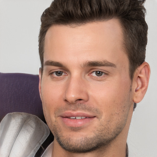 Joyful white young-adult male with short  brown hair and brown eyes