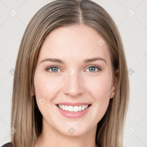 Joyful white young-adult female with long  brown hair and grey eyes