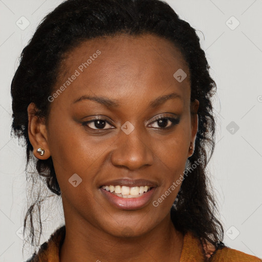 Joyful black young-adult female with long  brown hair and brown eyes