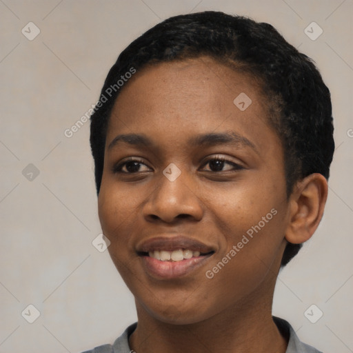 Joyful black young-adult female with short  black hair and brown eyes