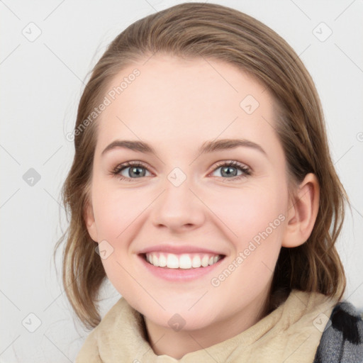 Joyful white young-adult female with medium  brown hair and blue eyes