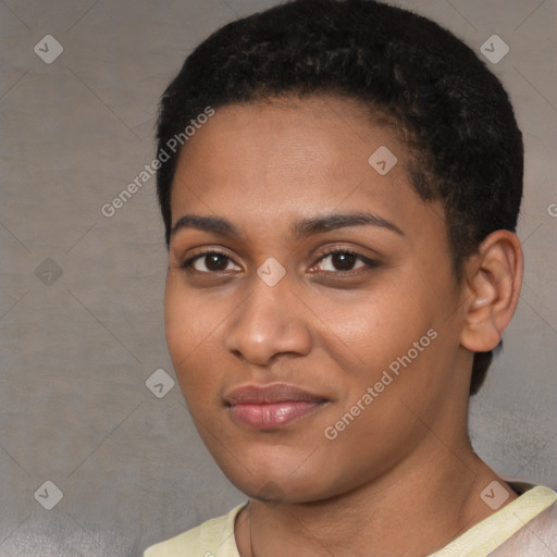 Joyful black young-adult female with short  black hair and brown eyes