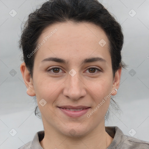 Joyful white adult female with short  brown hair and brown eyes