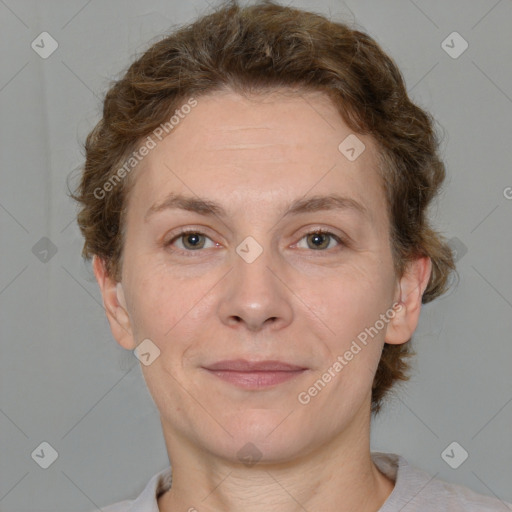 Joyful white adult female with short  brown hair and grey eyes