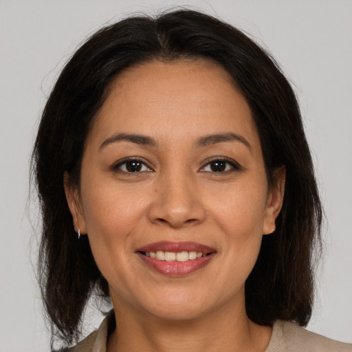 Joyful white young-adult female with medium  brown hair and brown eyes