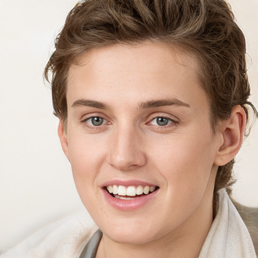 Joyful white young-adult female with long  brown hair and green eyes