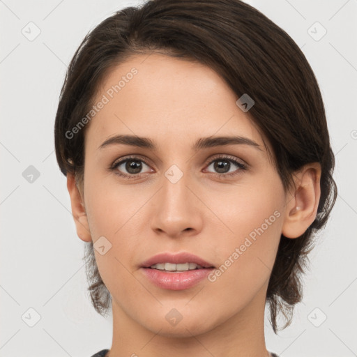 Joyful white young-adult female with medium  brown hair and brown eyes