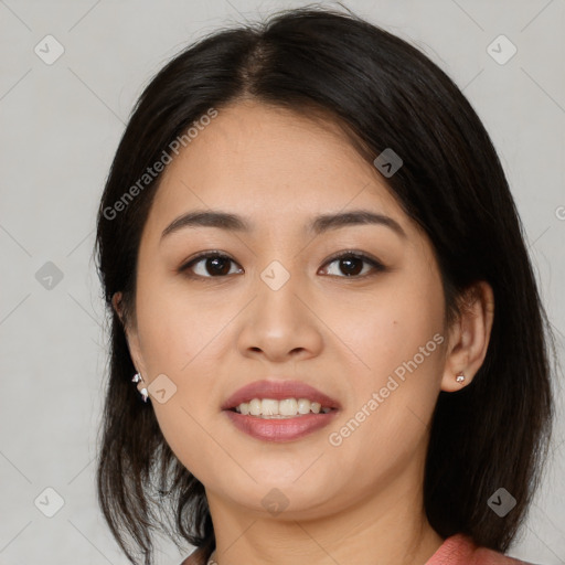 Joyful latino young-adult female with medium  brown hair and brown eyes