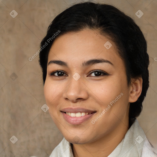 Joyful latino young-adult female with medium  brown hair and brown eyes