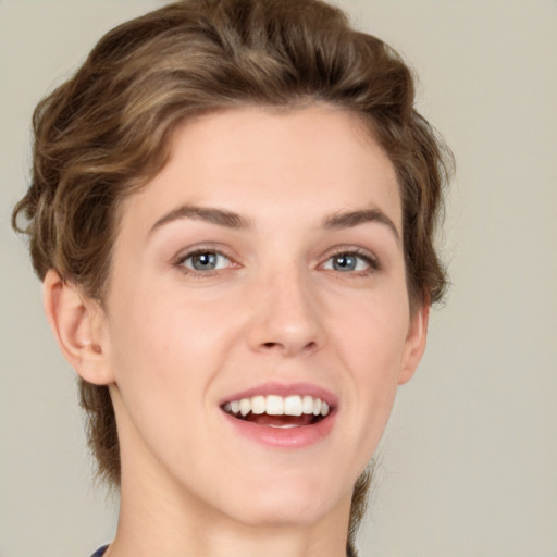 Joyful white young-adult female with medium  brown hair and green eyes