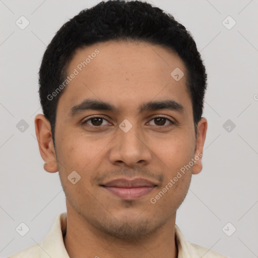 Joyful latino young-adult male with short  black hair and brown eyes