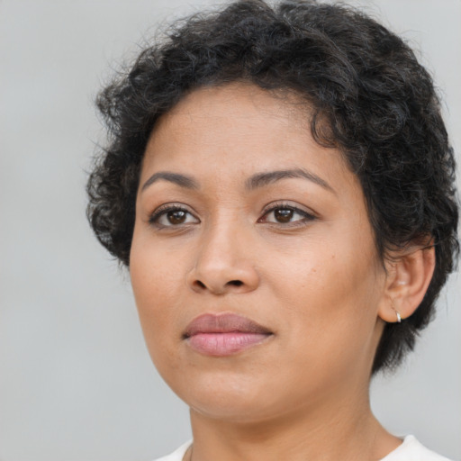 Neutral latino young-adult female with short  brown hair and brown eyes