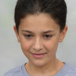 Joyful white child female with short  brown hair and brown eyes