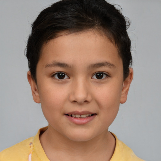 Joyful white child female with short  brown hair and brown eyes