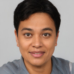 Joyful asian young-adult male with short  black hair and brown eyes