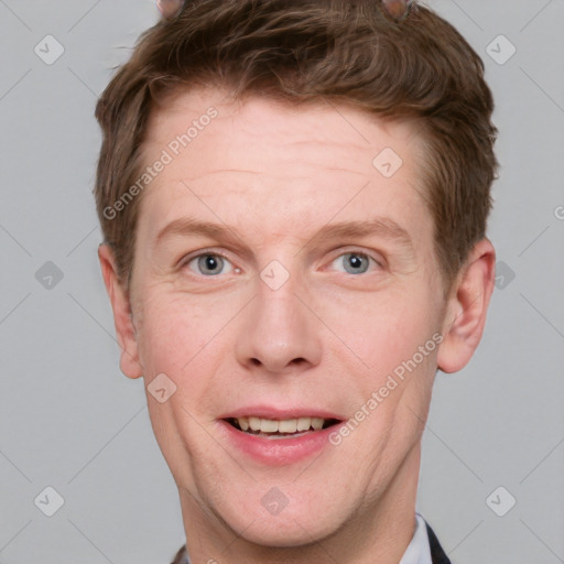 Joyful white adult male with short  brown hair and grey eyes