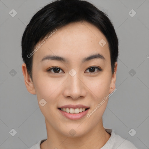 Joyful asian young-adult female with short  black hair and brown eyes